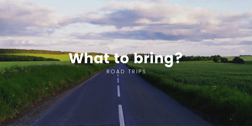 Campervan parked at scenic overlook, packed for a long road trip adventure. Luggage visible.