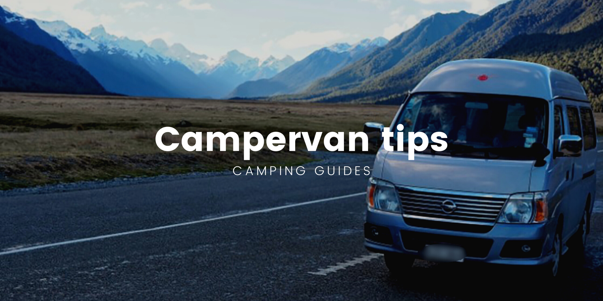 Scenic Kiwi roadie: Campervan overlooking a stunning lake in New Zealand.