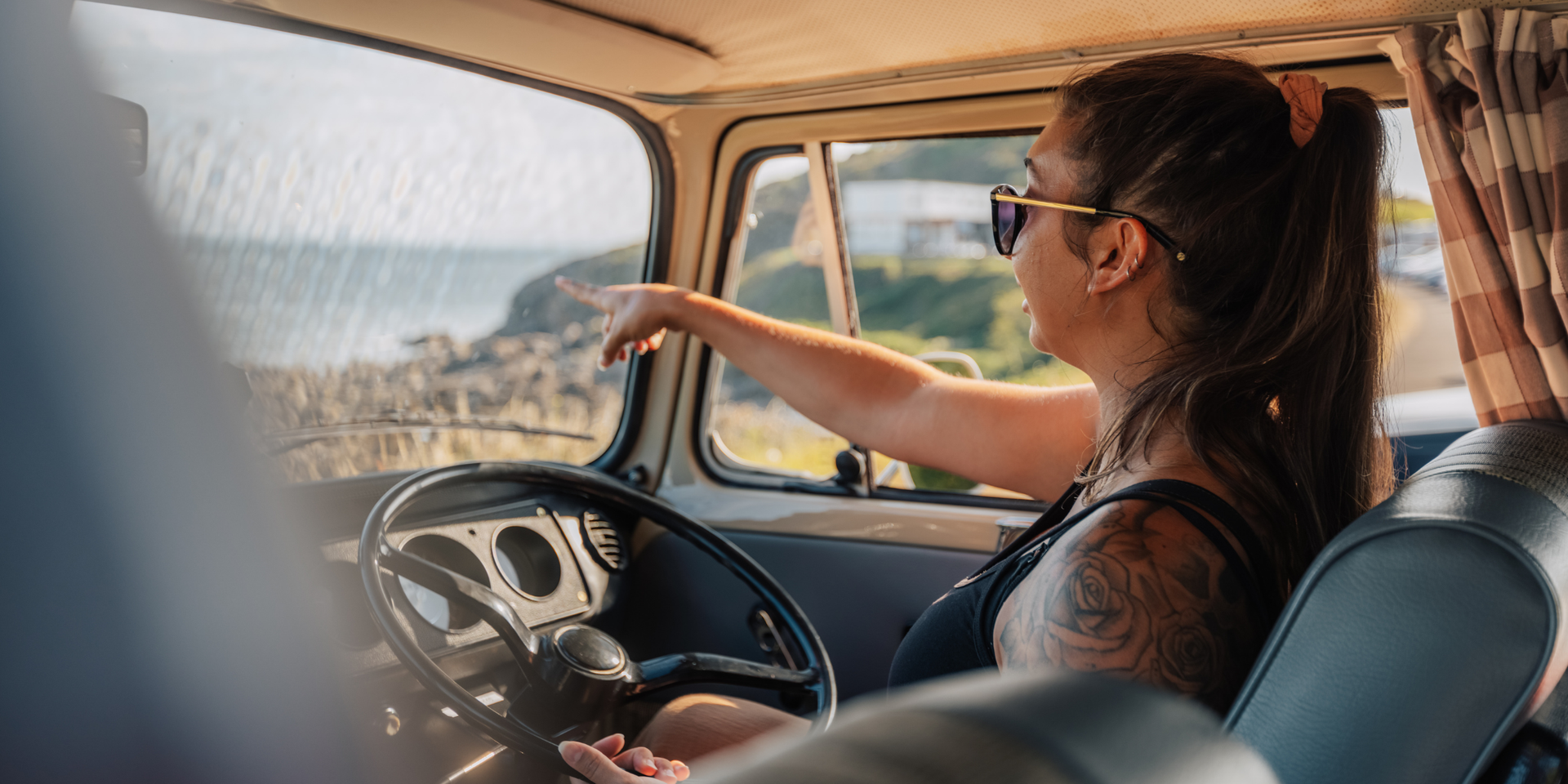 Campervan overlooking scenic Welsh coastline. Road trip adventure in South Wales.