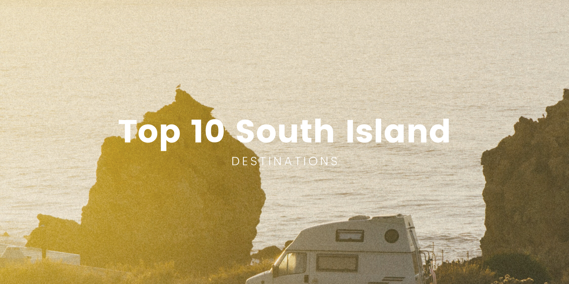 Scenic shot of campervan overlooking a turquoise lake in the South Island, NZ.