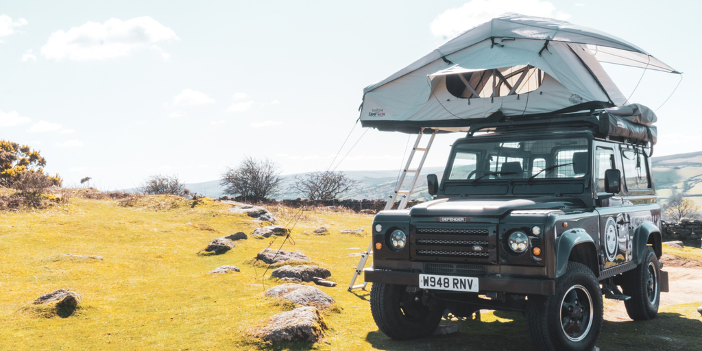 Campervan overlooking scenic Cornish coastline. Perfect for a UK road trip getaway.