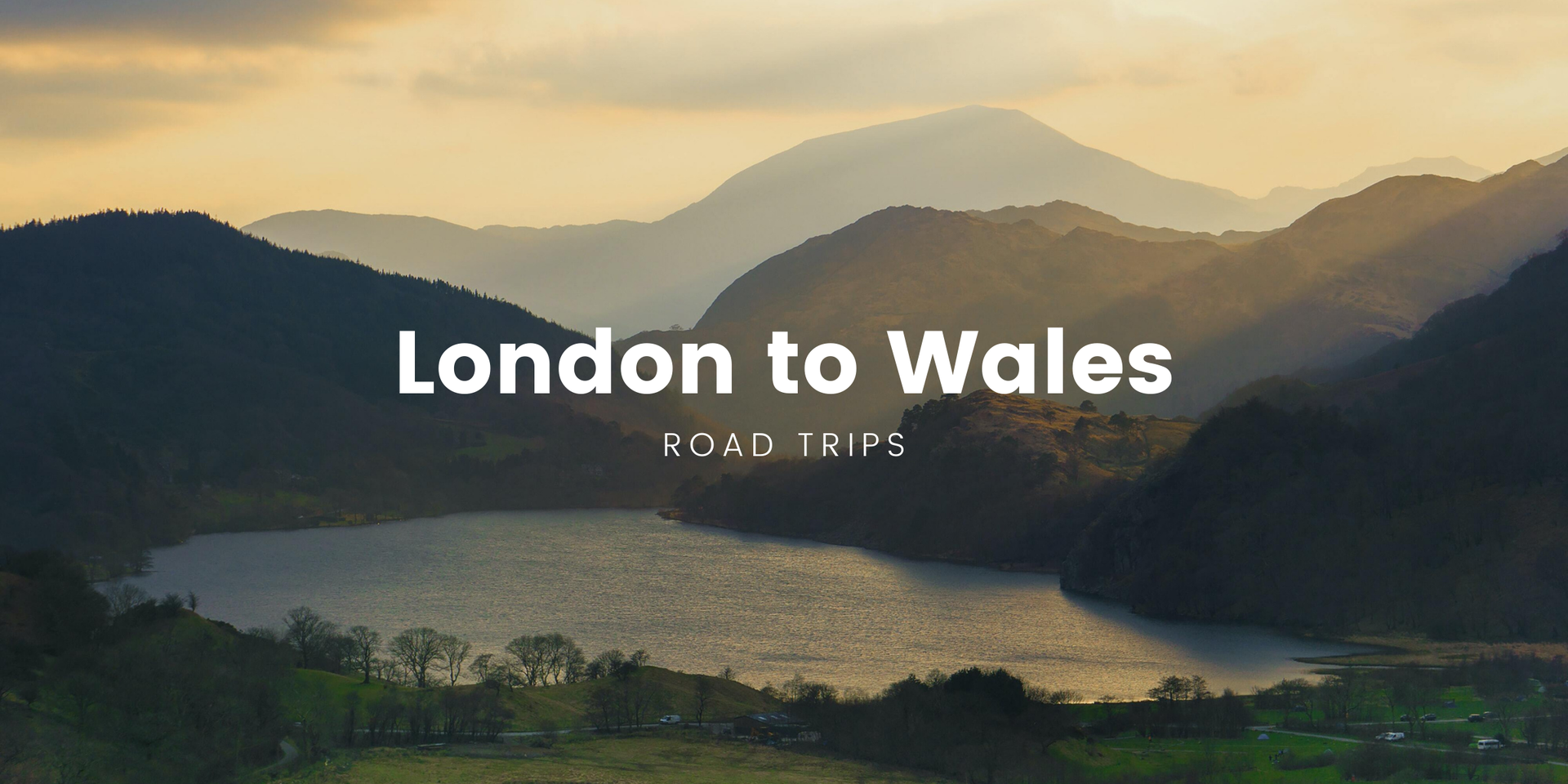 Campervan overlooking scenic Welsh mountains. Road trip adventure from London to Wales.