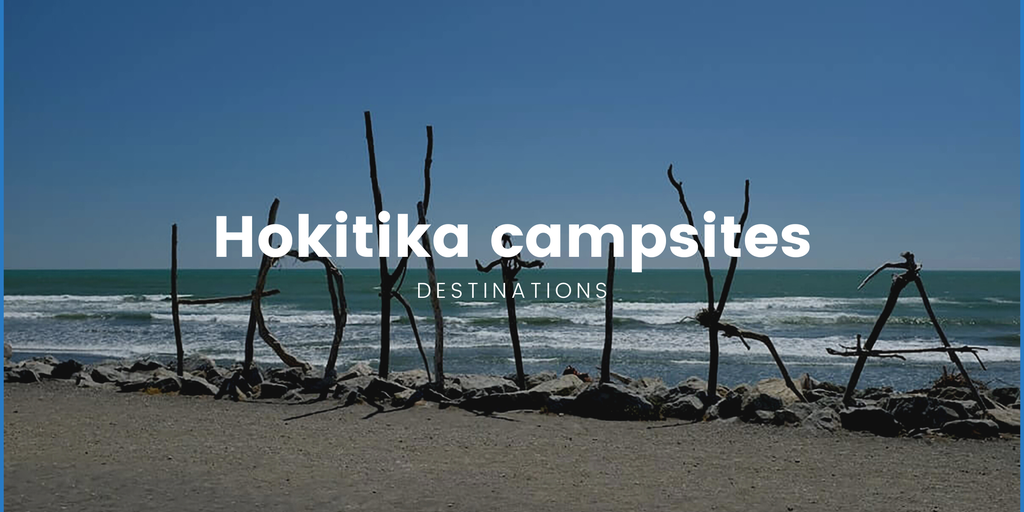 Tent pitched at a Hokitika campsite, with the Southern Alps in the background.