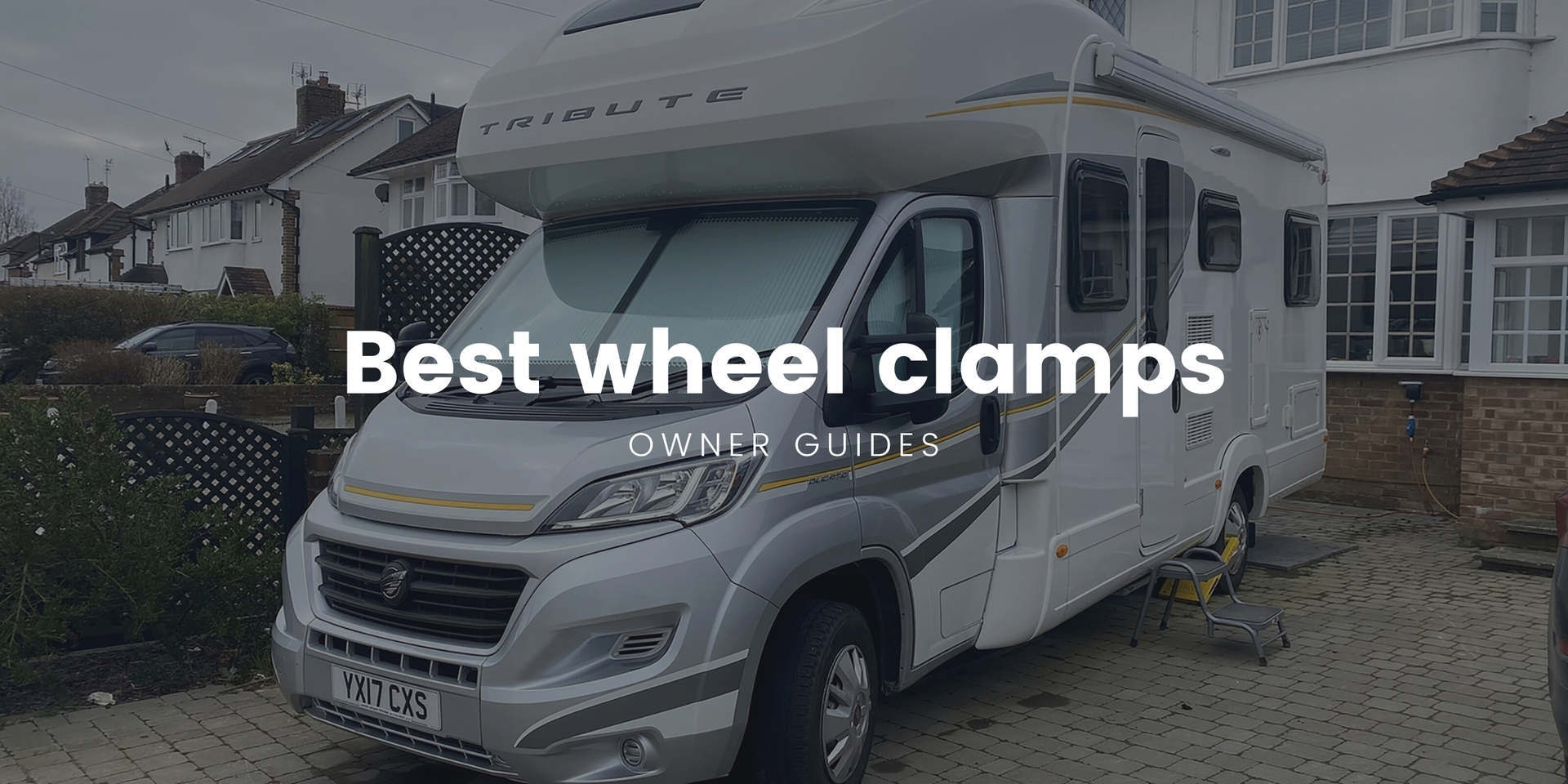 Motorhome parked up on a campsite, security wheel clamp fitted.