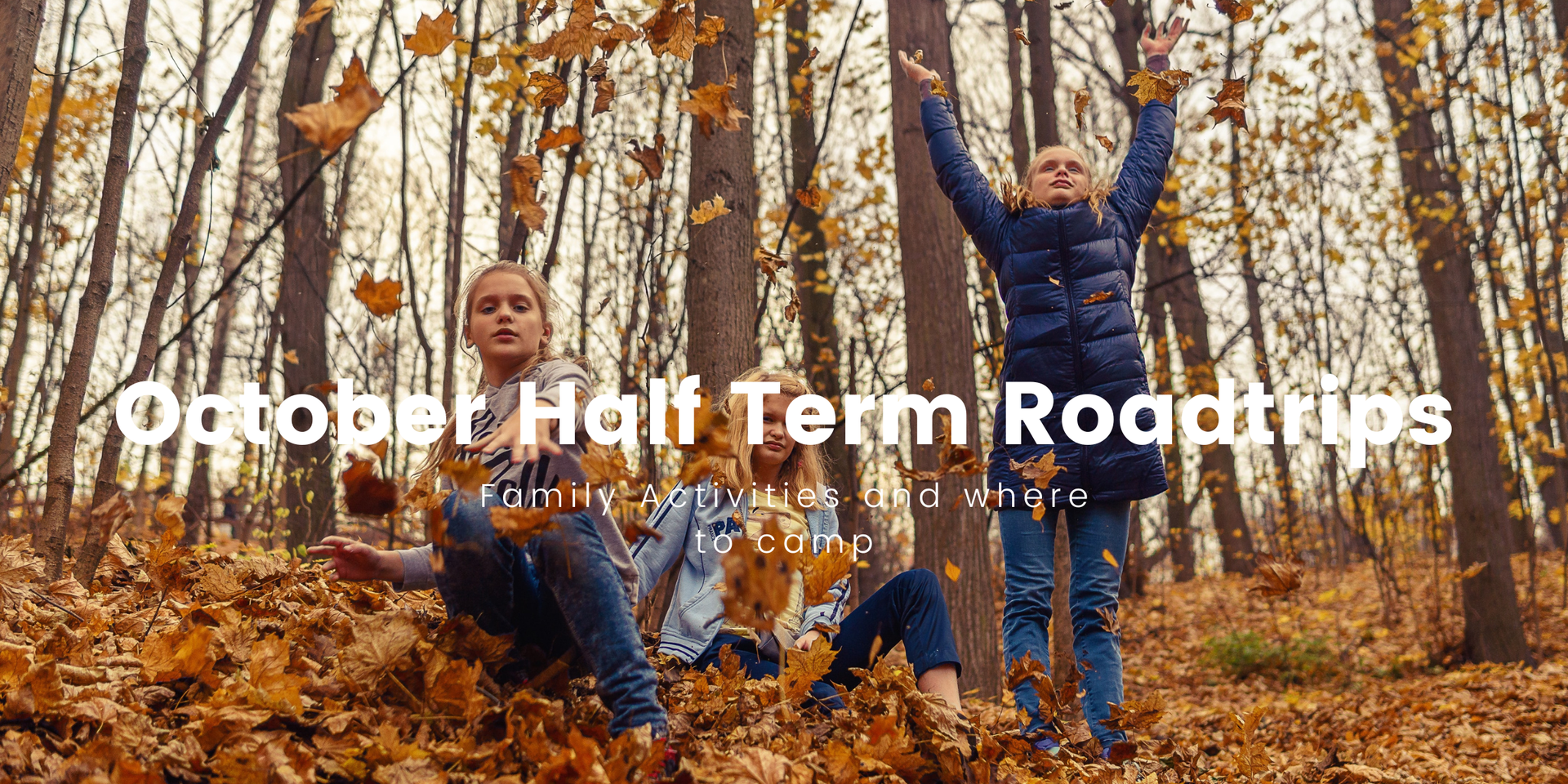 Family camping trip: tent pitched near a touring caravan at a British campsite.