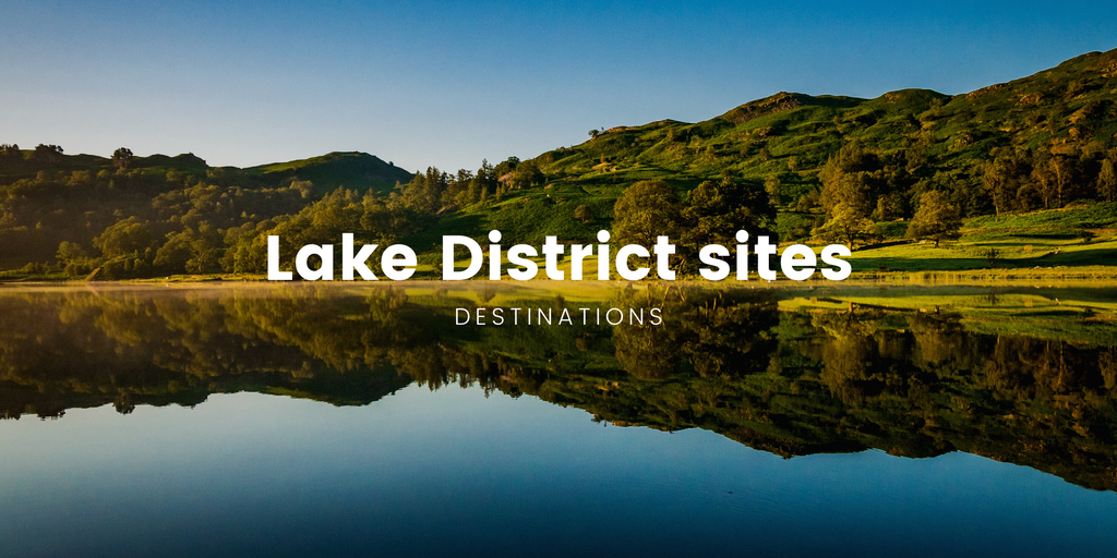 Motorhome parked at Lake District campsite with mountain views. Camping holiday in the Lakes.