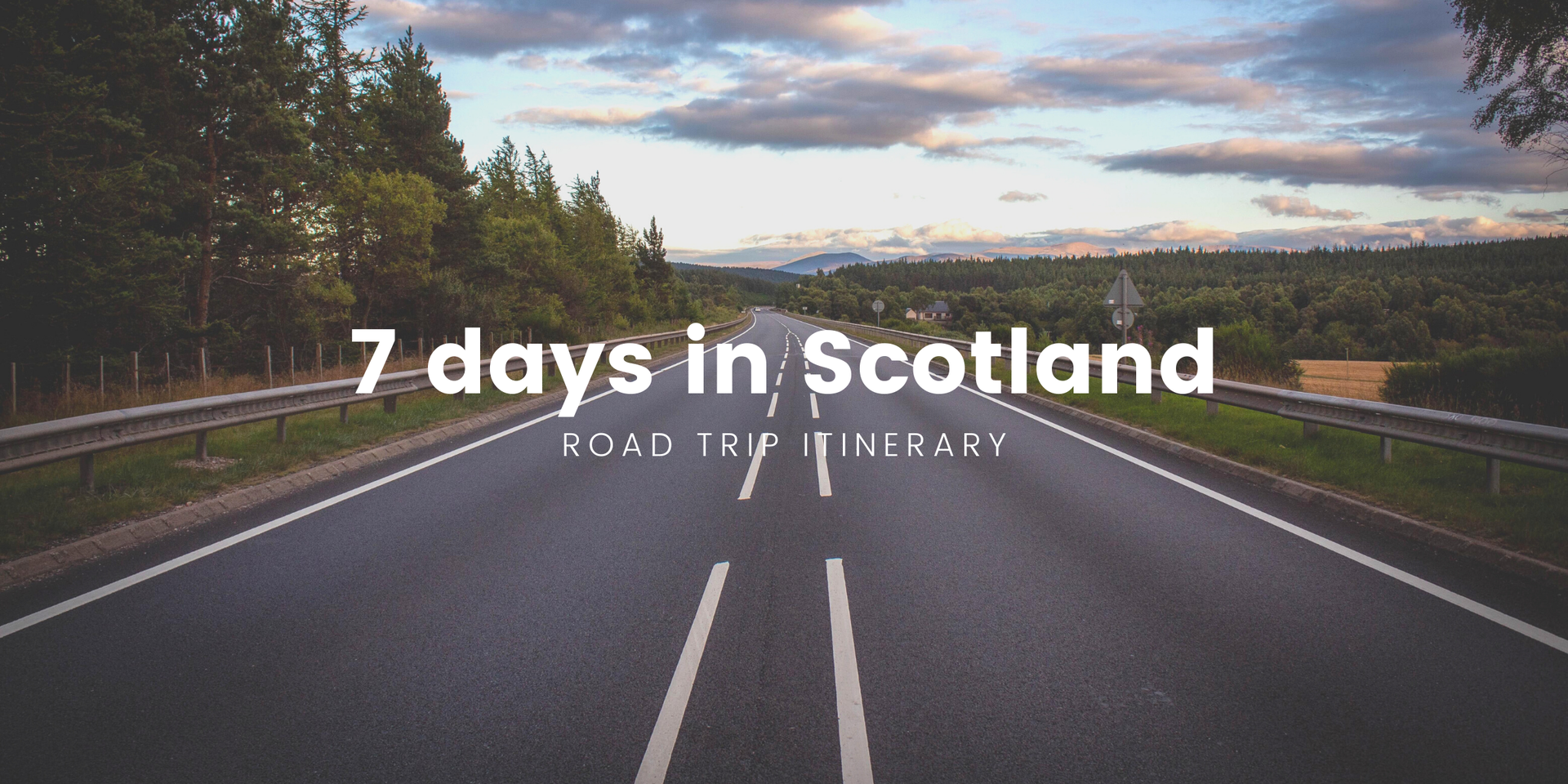 Campervan on scenic Scottish road trip, with mountains in background. Perfect for a van life holiday.