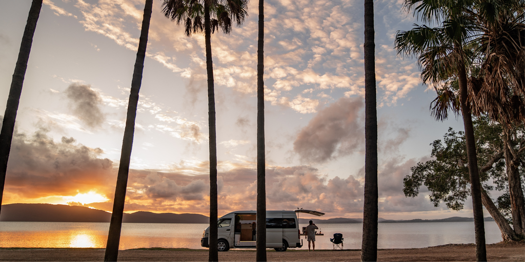 Campervan overlooking turquoise ocean on the Pacific Coast Touring Route.
