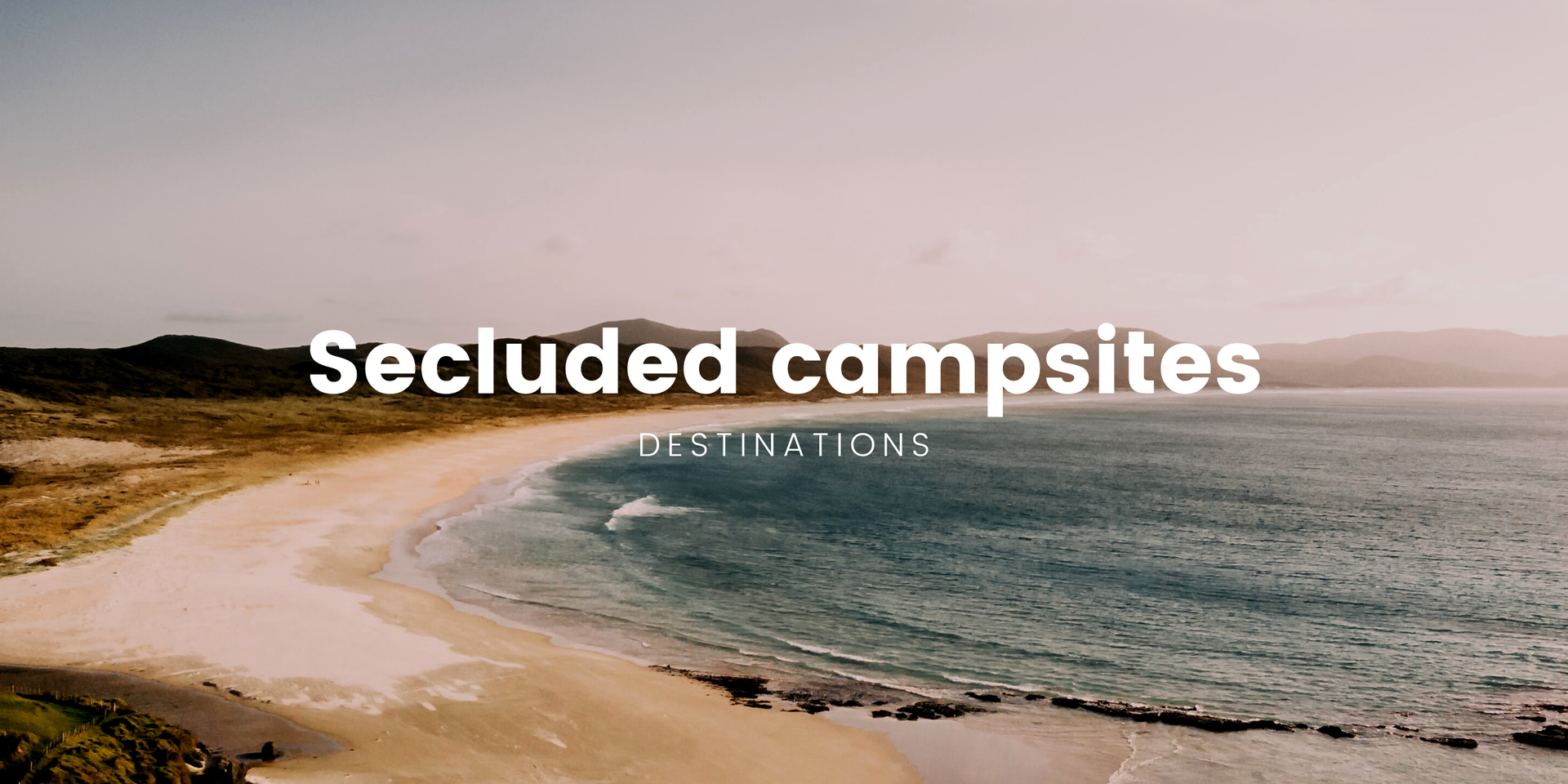 Campervan parked at remote campsite overlooking a stunning NZ mountain range.