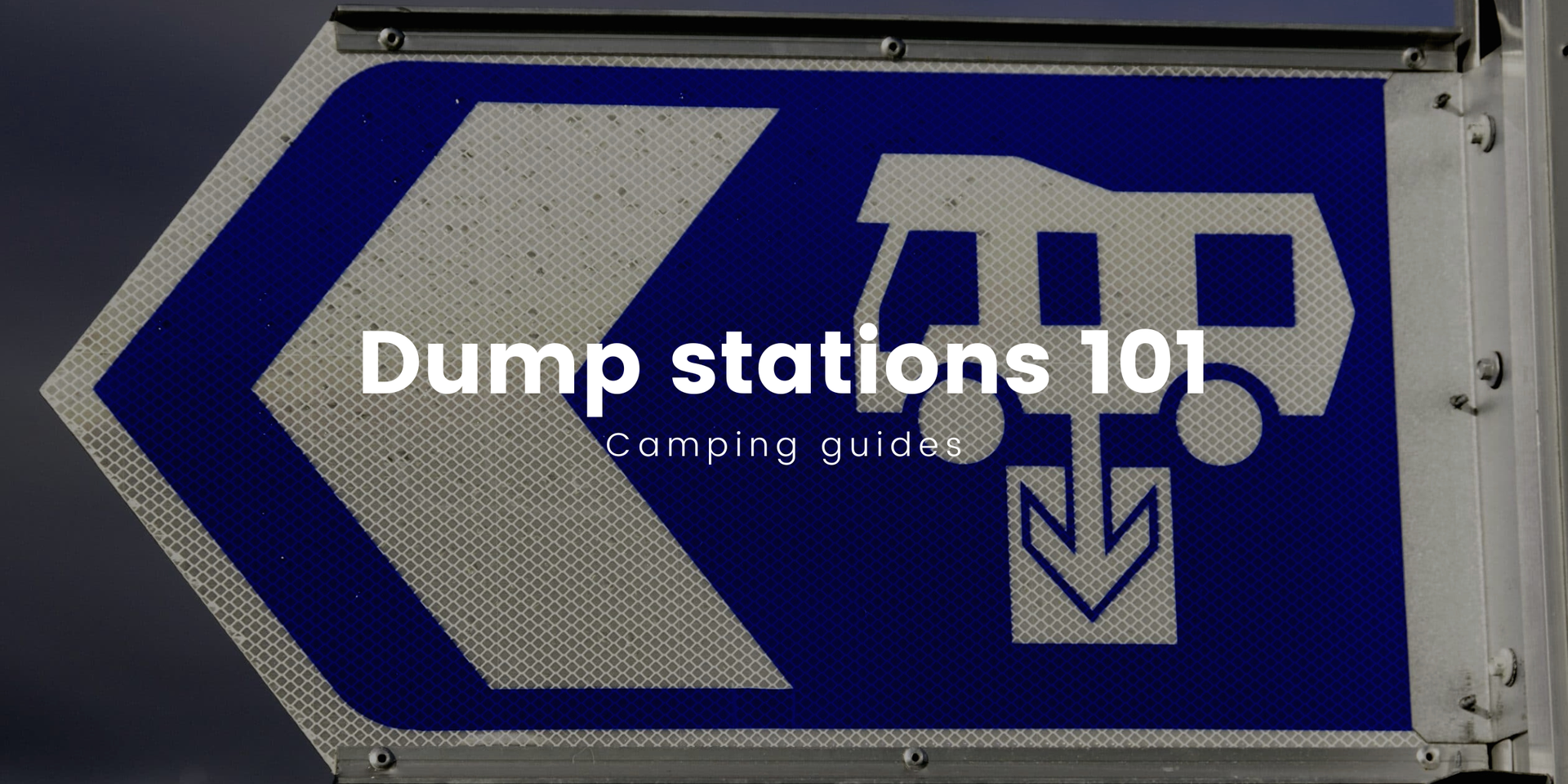 Motorhome parked at a Kiwi dump station, ready to empty the wastewater tanks after a road trip.