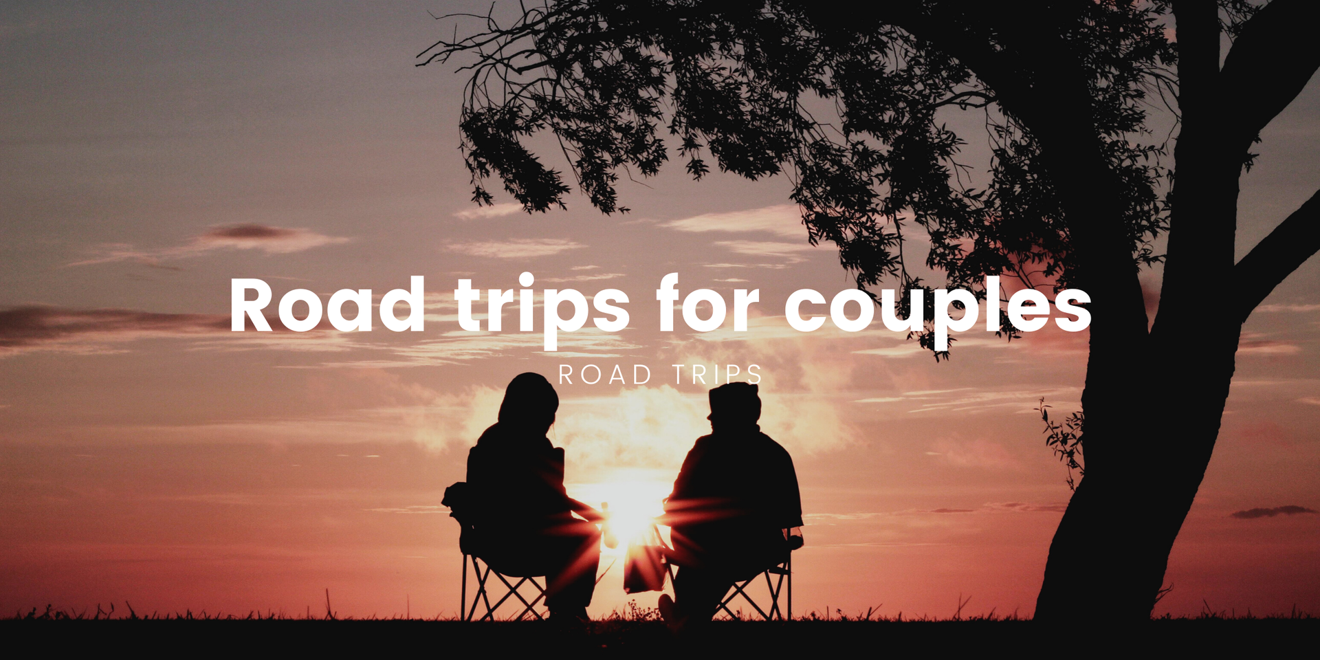 Couple camping in a VW campervan, enjoying a romantic UK road trip with scenic countryside views.