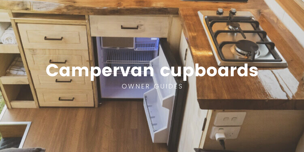 Campervan parked up at a stunning lakeside spot, gear neatly stowed inside for an awesome adventure.