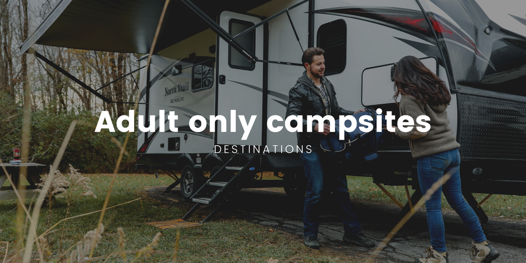 Tranquil campsite scene: Caravan nestled amongst trees, ideal for an adults-only UK getaway.