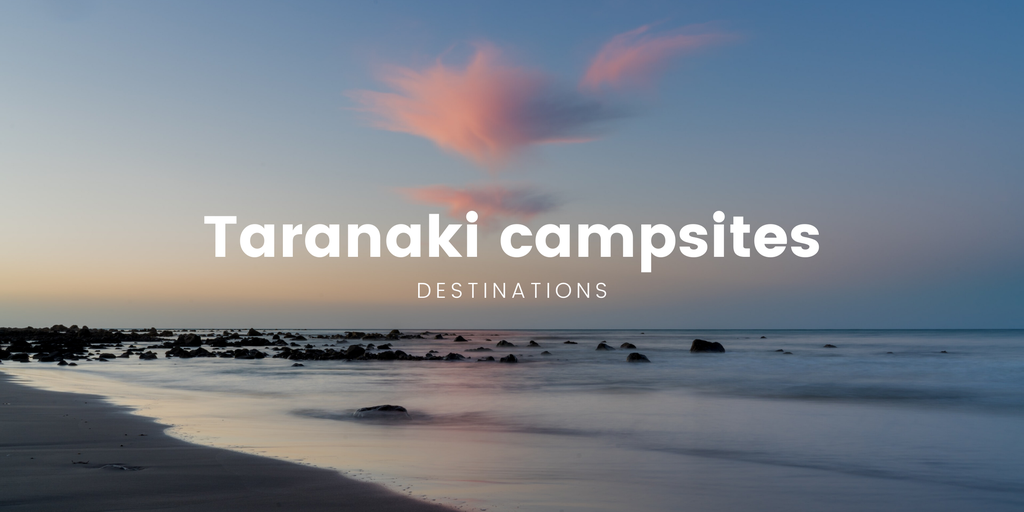 Tent pitched at a campsite, with Mount Taranaki in the background and coastal views.