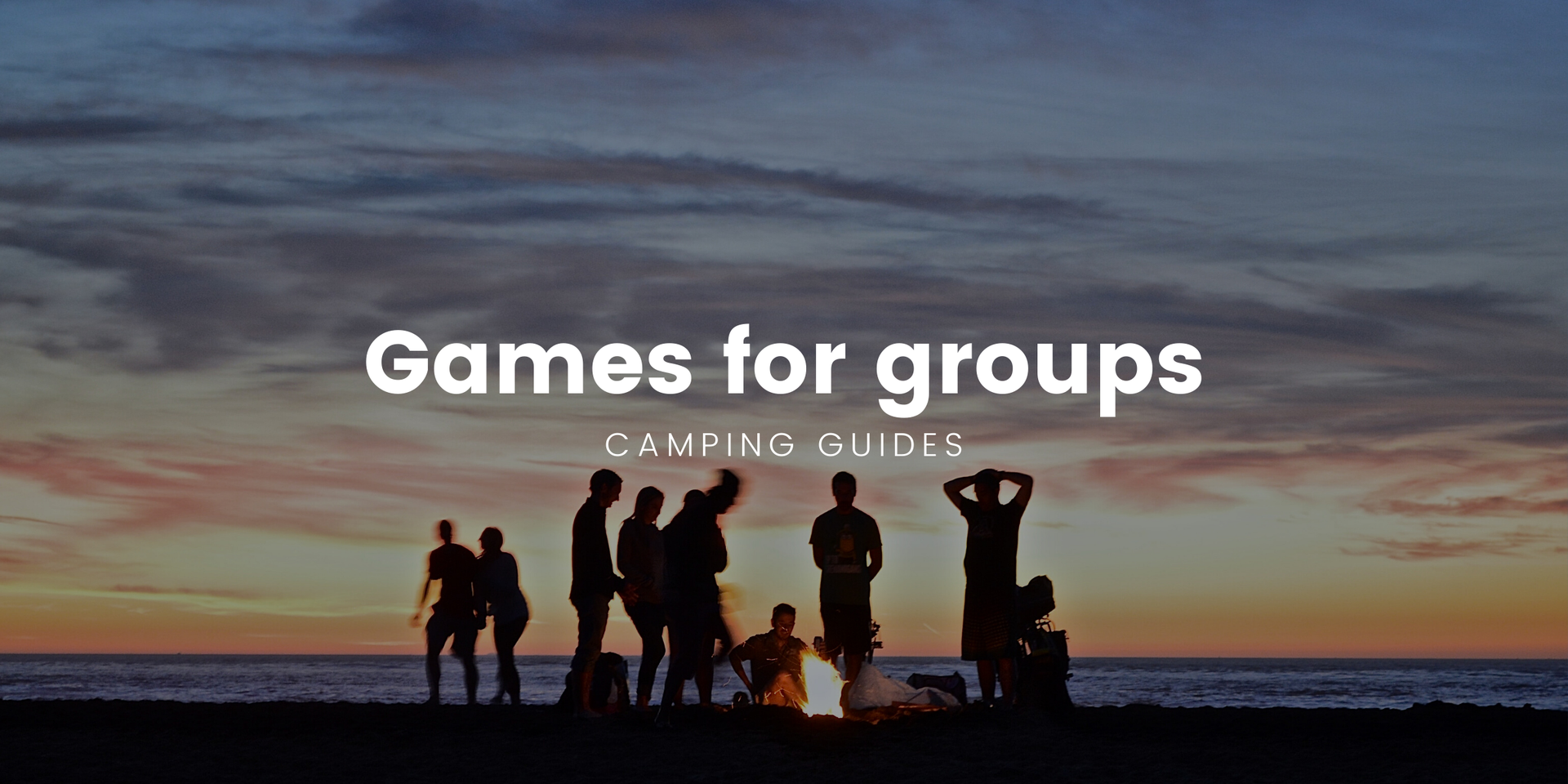 Kids playing a game of footy at a campsite, tents pitched in the background. Good times!