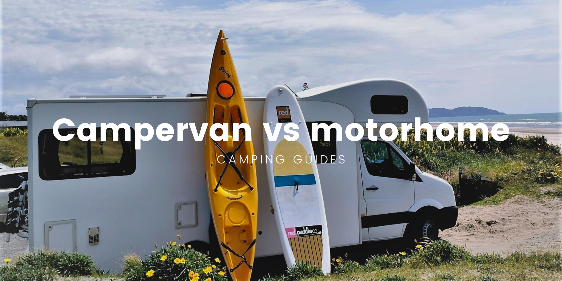 Campervan parked up overlooking a stunning lake in Aotearoa.