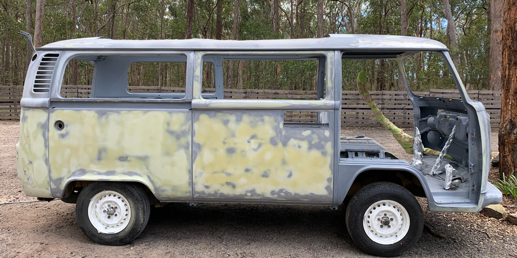 Campervan parked up at a bush campsite, ready for adventure.