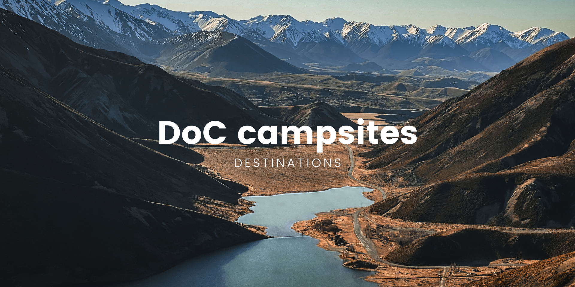 Campervan parked up at a gorgeous DoC campsite, ready for some freedom camping in the New Zealand bush.