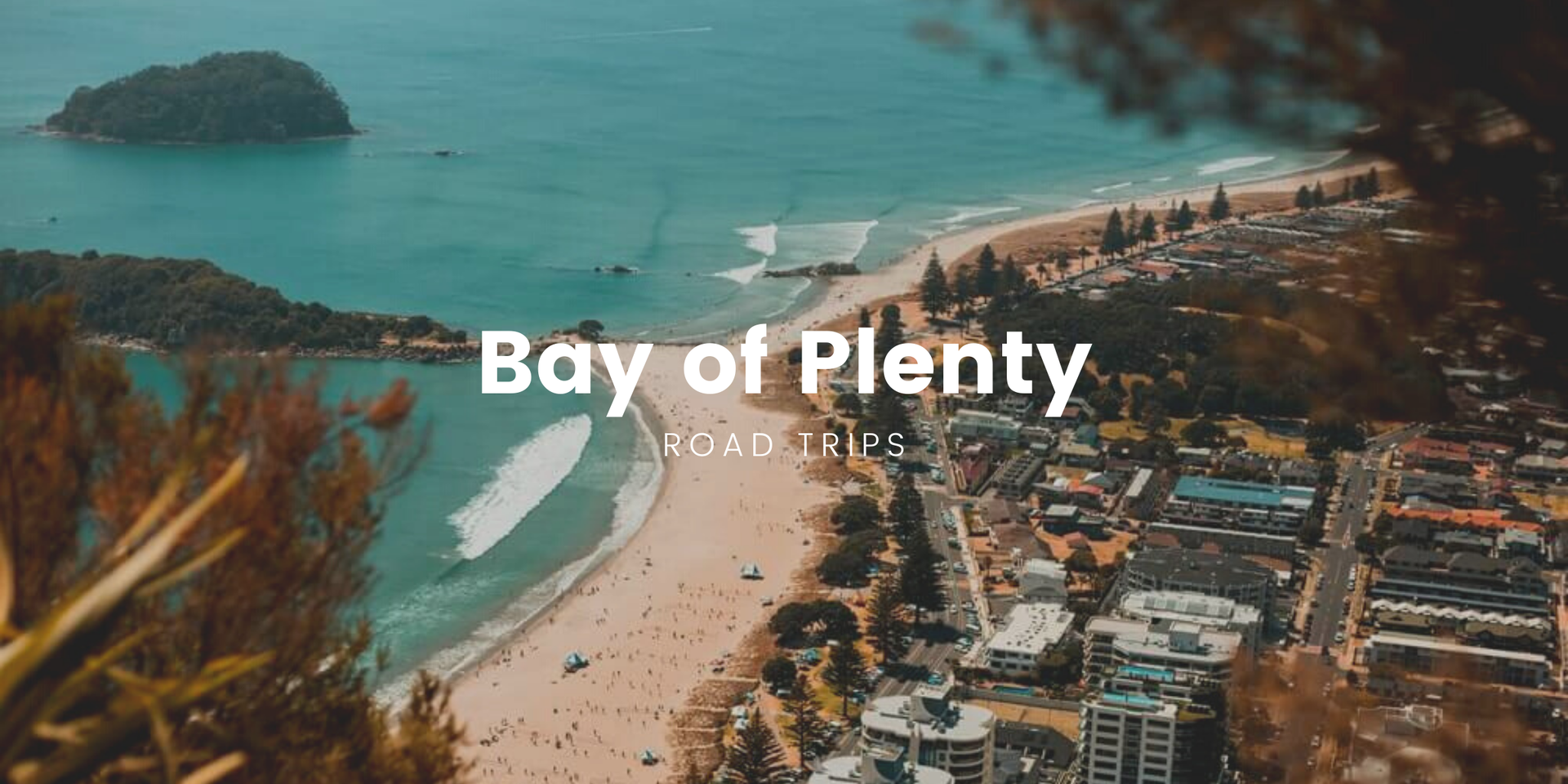 Scenic Bay of Plenty coastline, perfect for a campervan roadie, with a tent pitched on the beach.