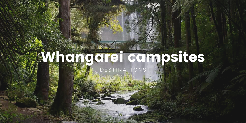 Tent pitched at a Whangarei Heads campground, overlooking a scenic beach.