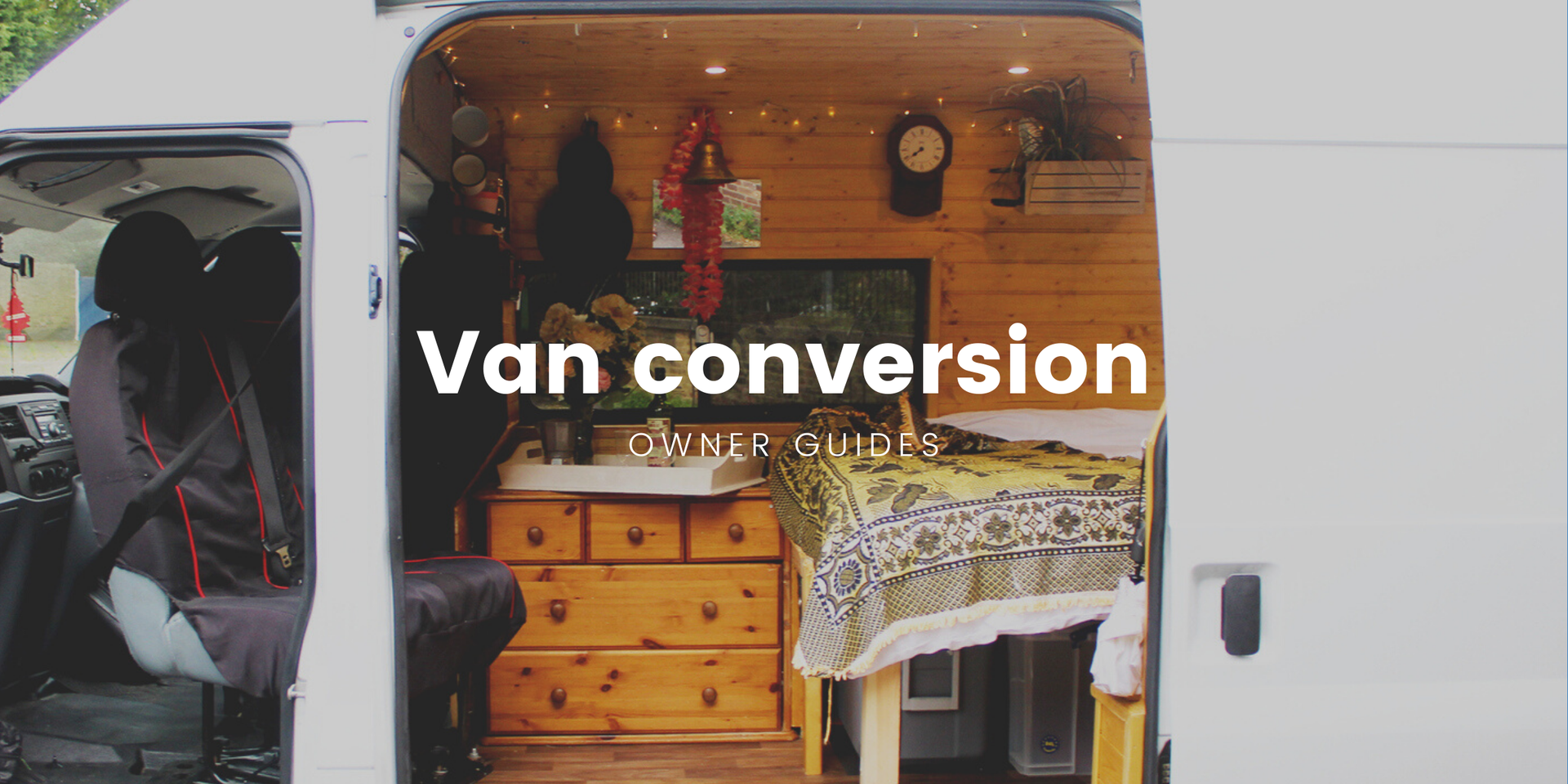 Campervan parked overlooking stunning Scottish loch on a road trip holiday.