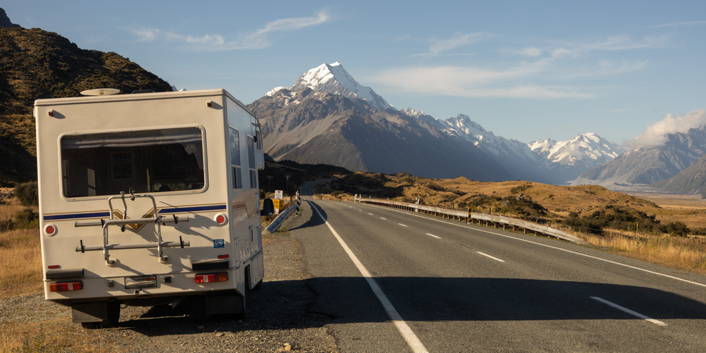 Campervan parked up with a view, ready for a Kiwi camping adventure.