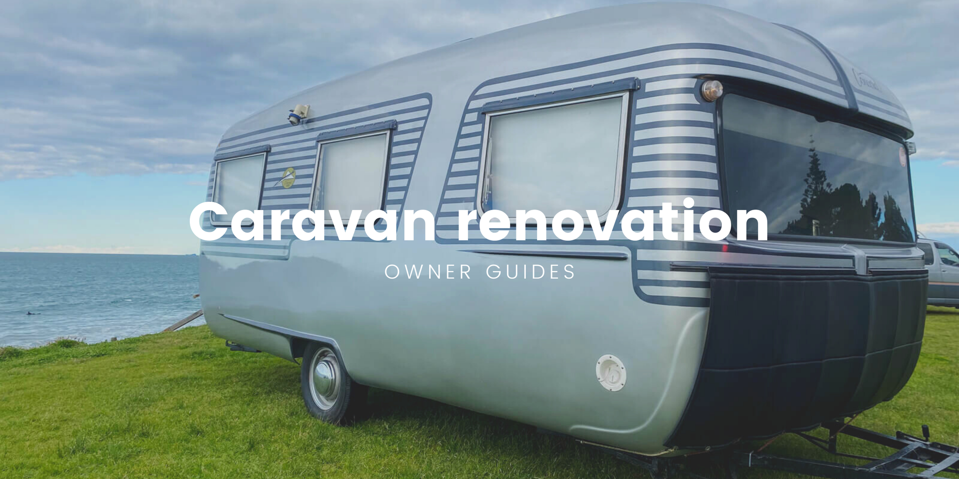 Caravan parked up at a beautiful Kiwi campsite, ready for a roadie.