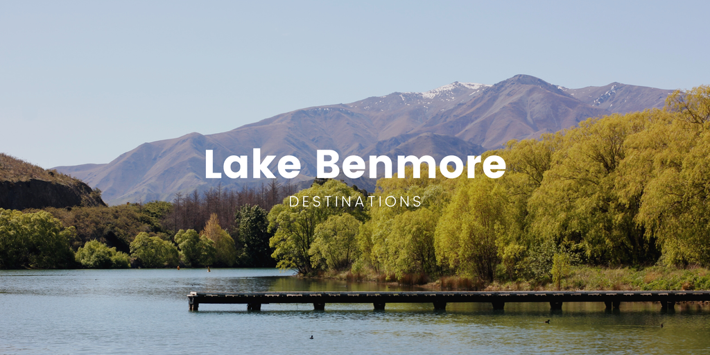 Tent pitched at Lake Benmore campsite with Southern Alps backdrop.