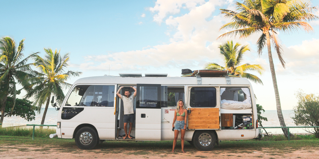 Campervan parked by a stunning Aussie beach, ready for a road trip adventure.