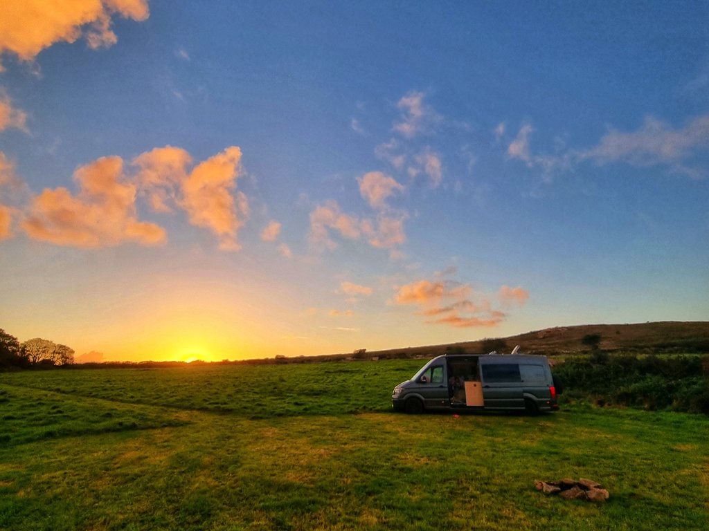 Tent pitched in a scenic meadow, Dartmoor. Wild camping in the UK countryside.