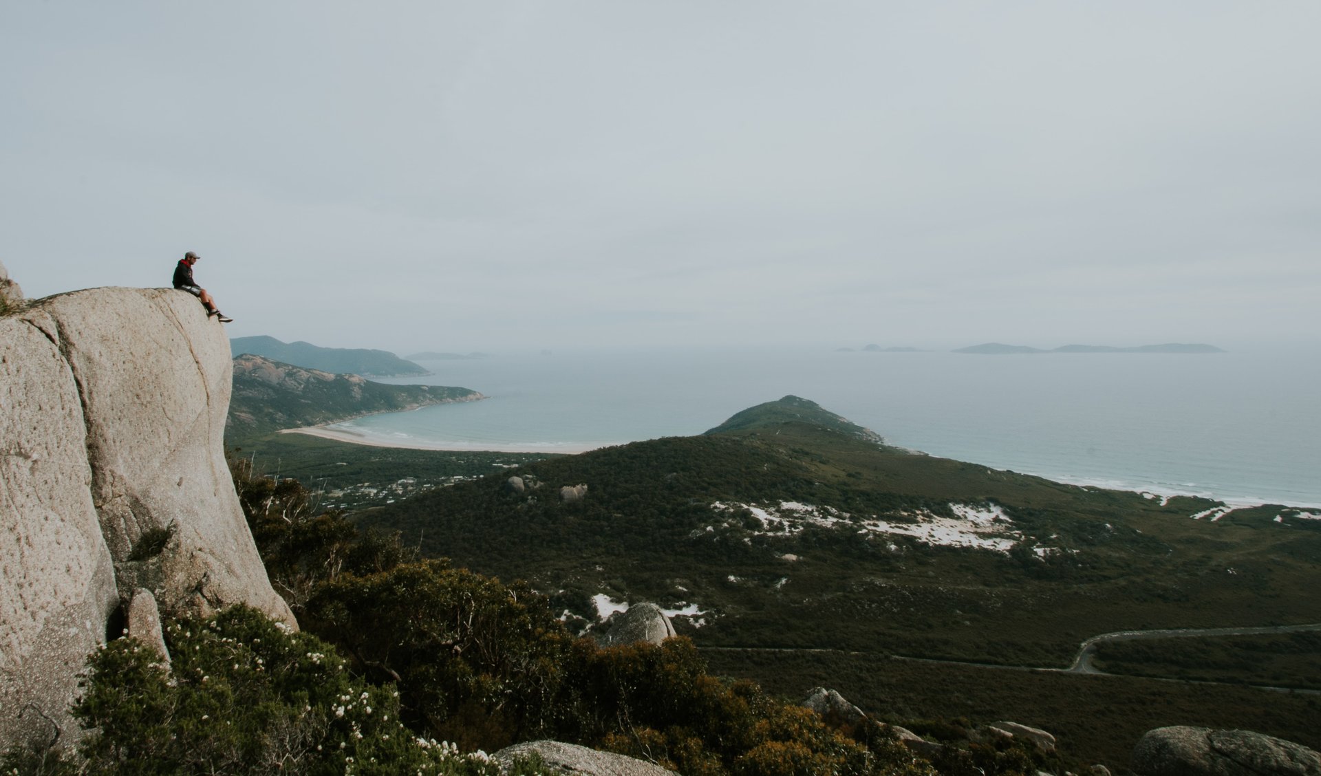 Coastal campground at Wilsons Prom, with a campervan parked near the beach.
