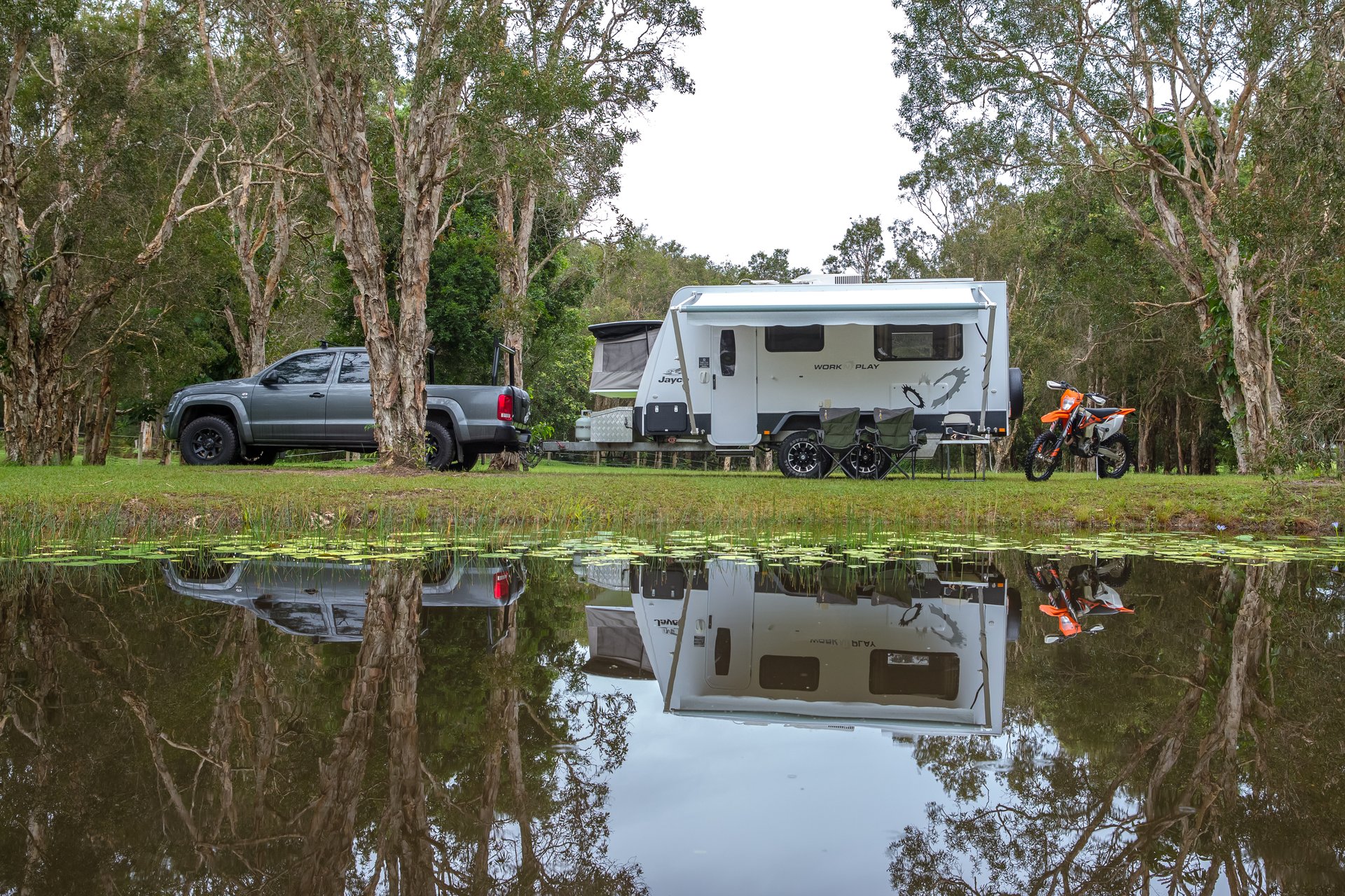 Toy hauler parked at a sunny caravan park, ready for Aussie adventures.