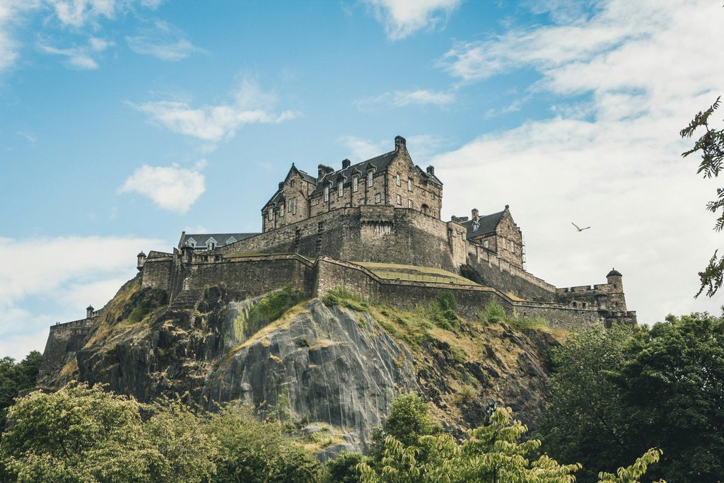 Tents pitched near Edinburgh, with rolling Scottish hills in the background. Perfect camping getaway.