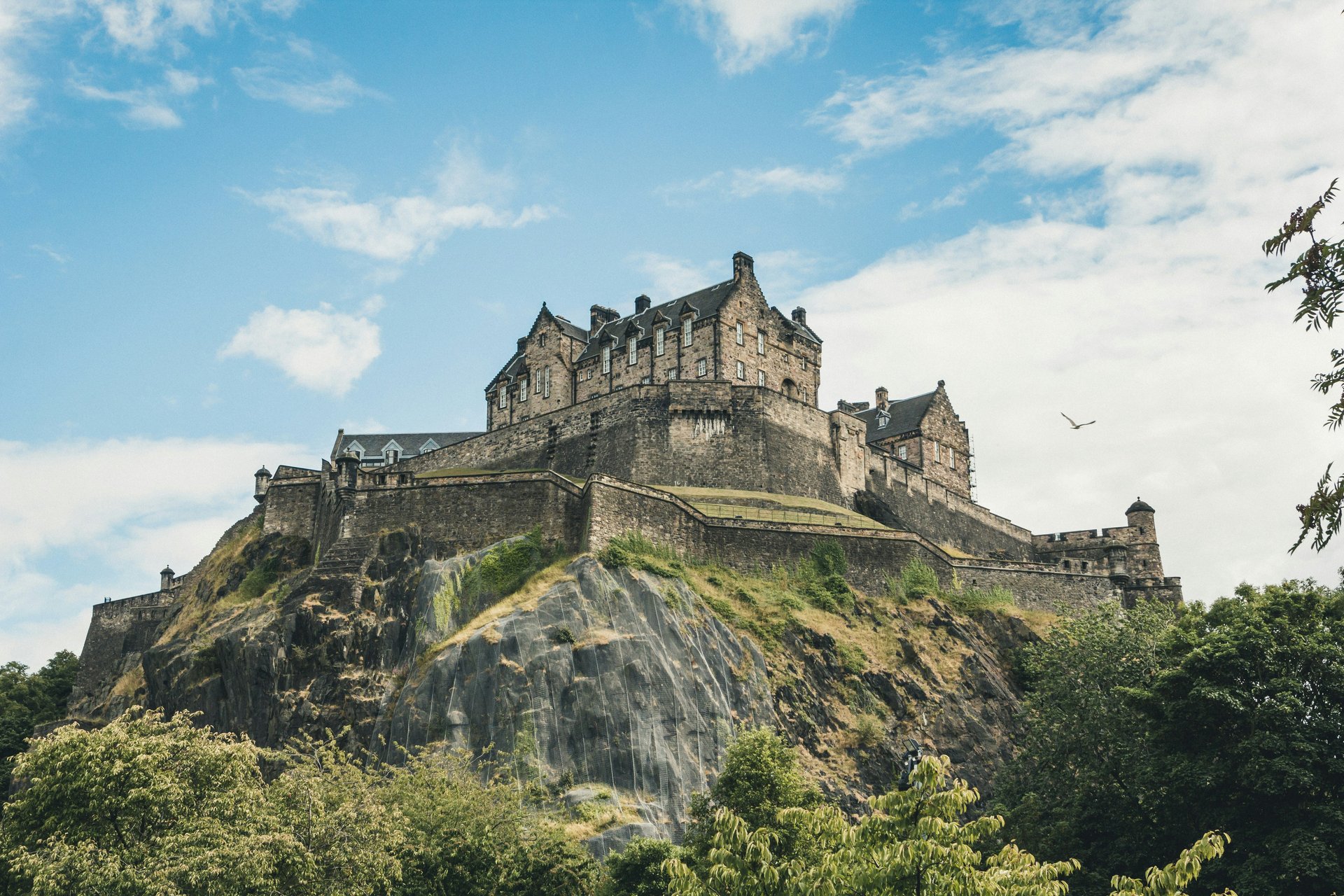 Tents pitched near Edinburgh, with rolling Scottish hills in the background. Perfect camping getaway.