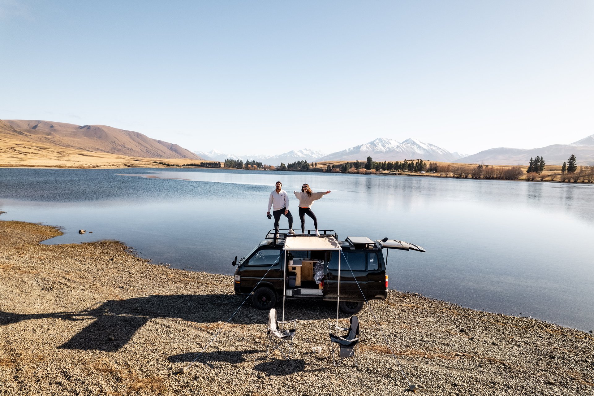 Snow-capped mountains and campervan on a Canterbury road trip, South Island.