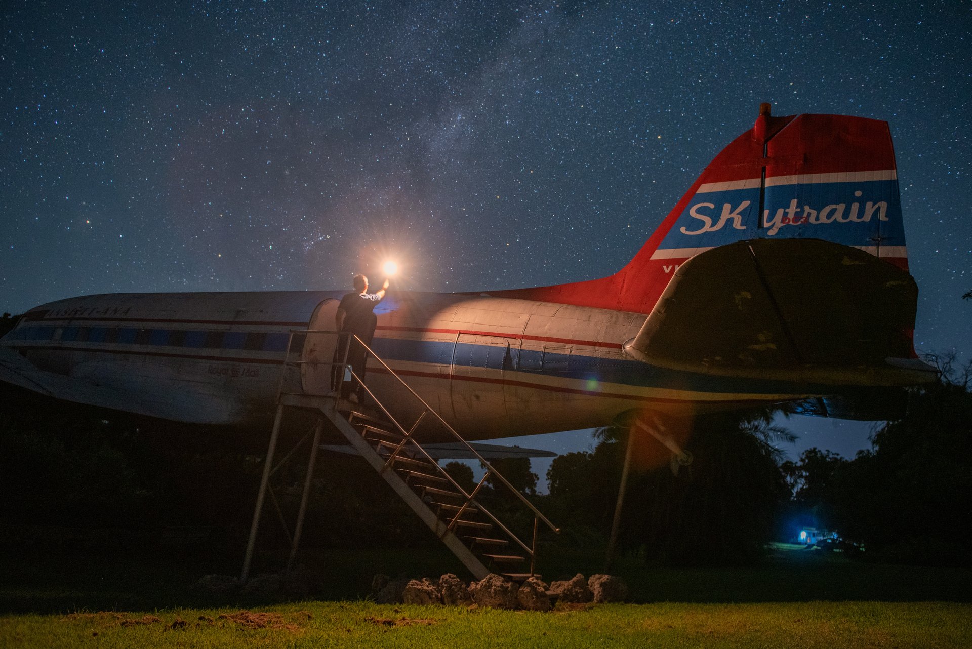 Family camping by the beach in WA with their dog and Camplify campervan.