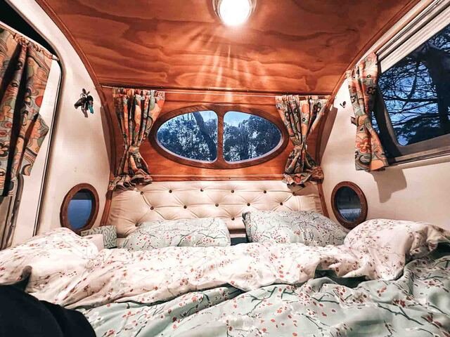 A bed inside a campervan