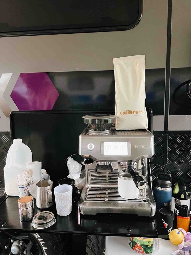 A coffee machine set up at a campsite