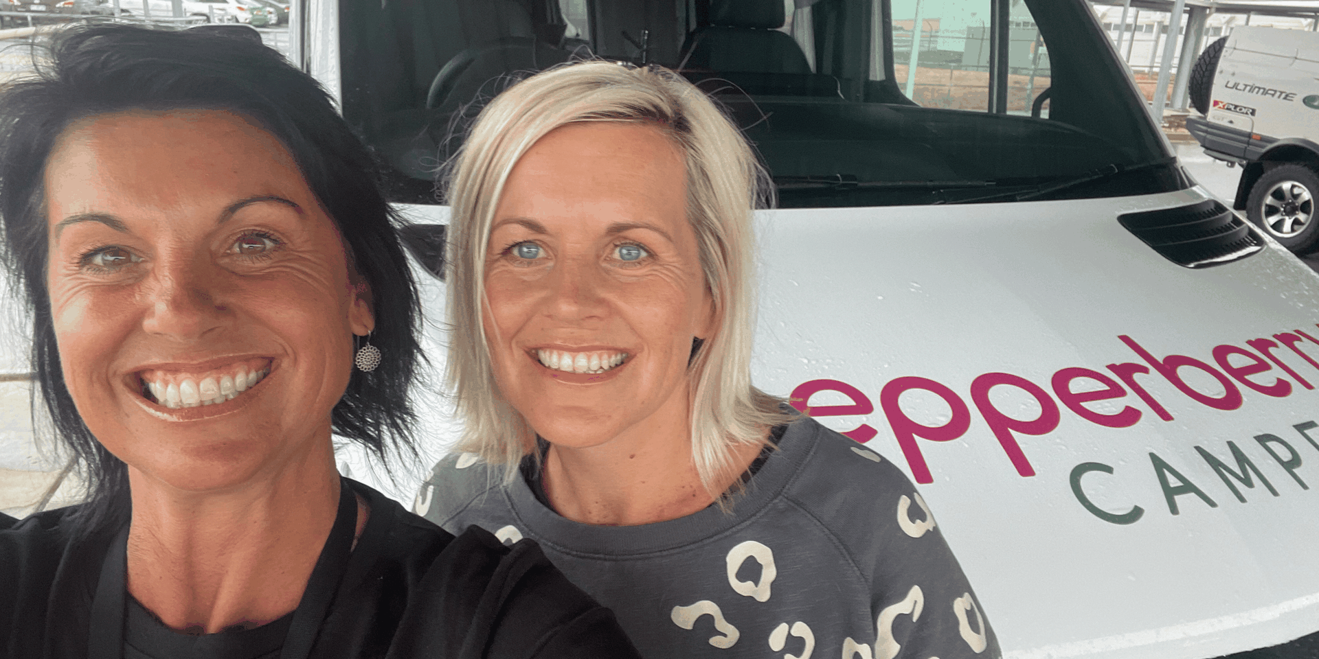Women camping in a caravan near the beach, enjoying the van life.
