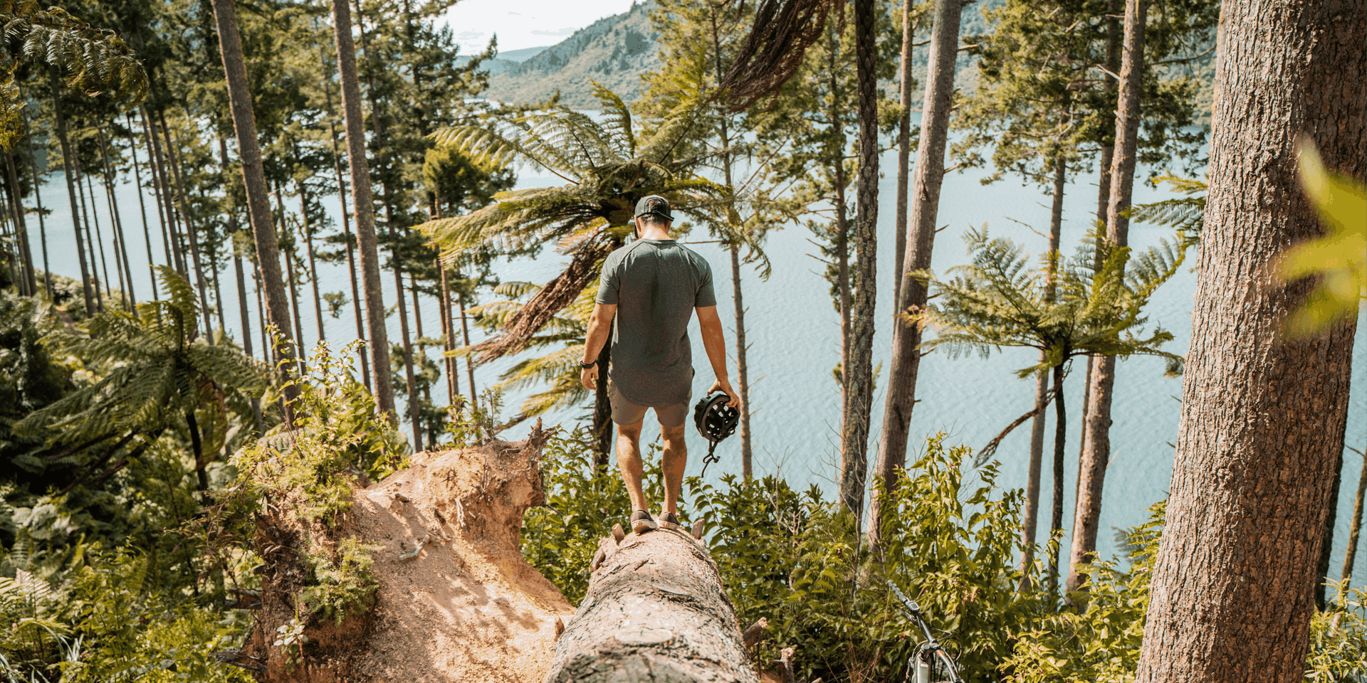 Scenic road trip: Campervan driving through lush Waikato farmland towards Rotorua's geothermal landscapes.