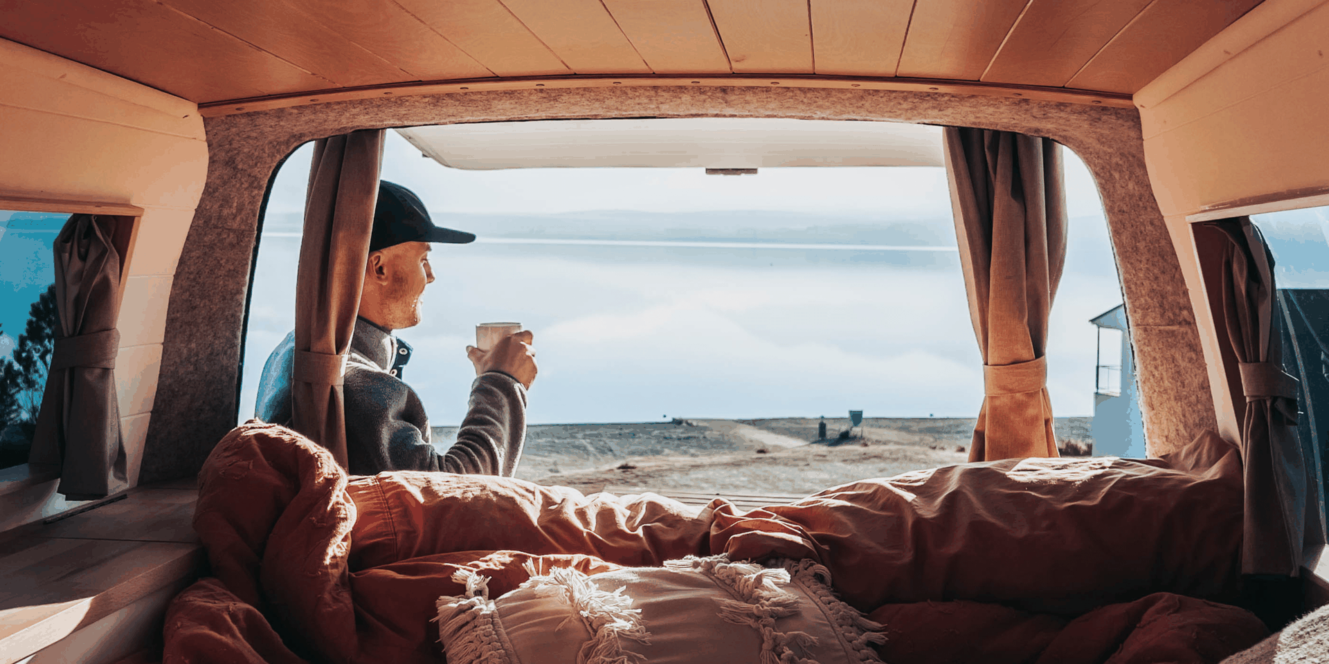 Campervan overlooking Lake Tekapo, Mackenzie Region. Freedom camping in the South Island.