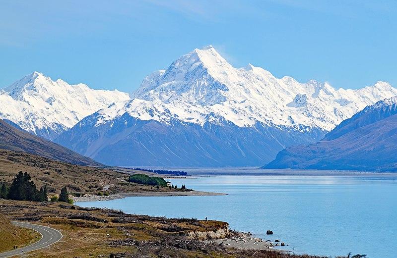 Caravan parked up overlooking a stunning South Island lake, ready for adventure.
