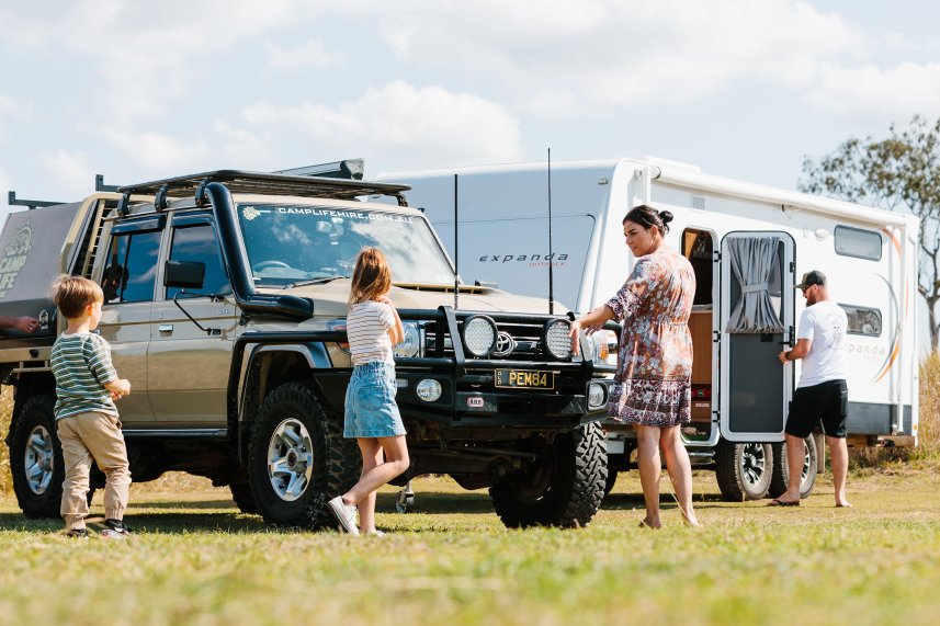 RV owners in front of their vehicles
