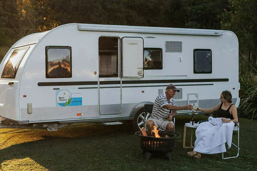 Retirees in front of a van