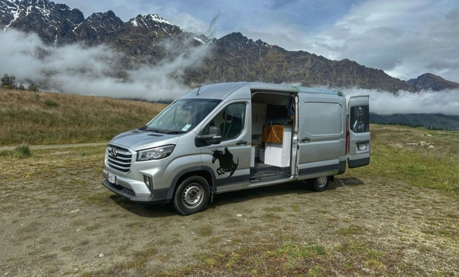 Campervan parked up, overlooking a stunning NZ lake. Road trip ready!