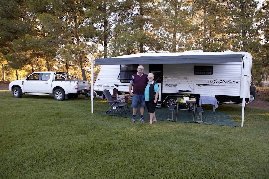 Caravan parked at a sunny campsite, ready for a weekend getaway.
