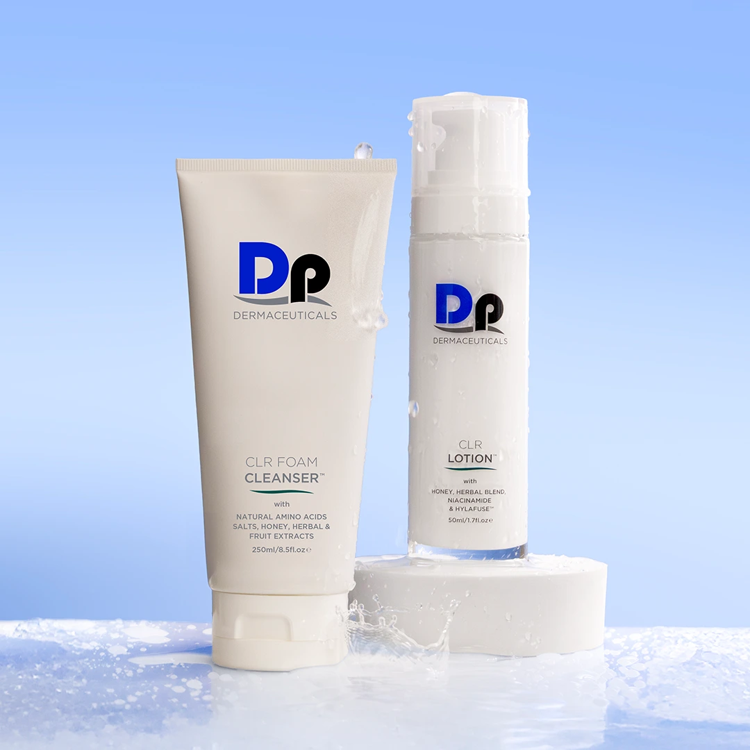 Image of two Dp Dermaceuticals products on a light blue background, with water splashing over them.