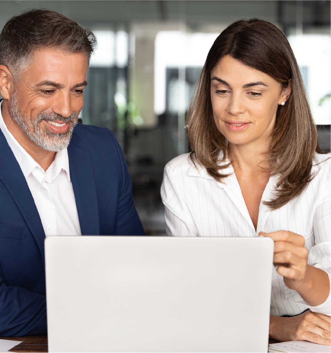 Two work colleagues looking at a laptop