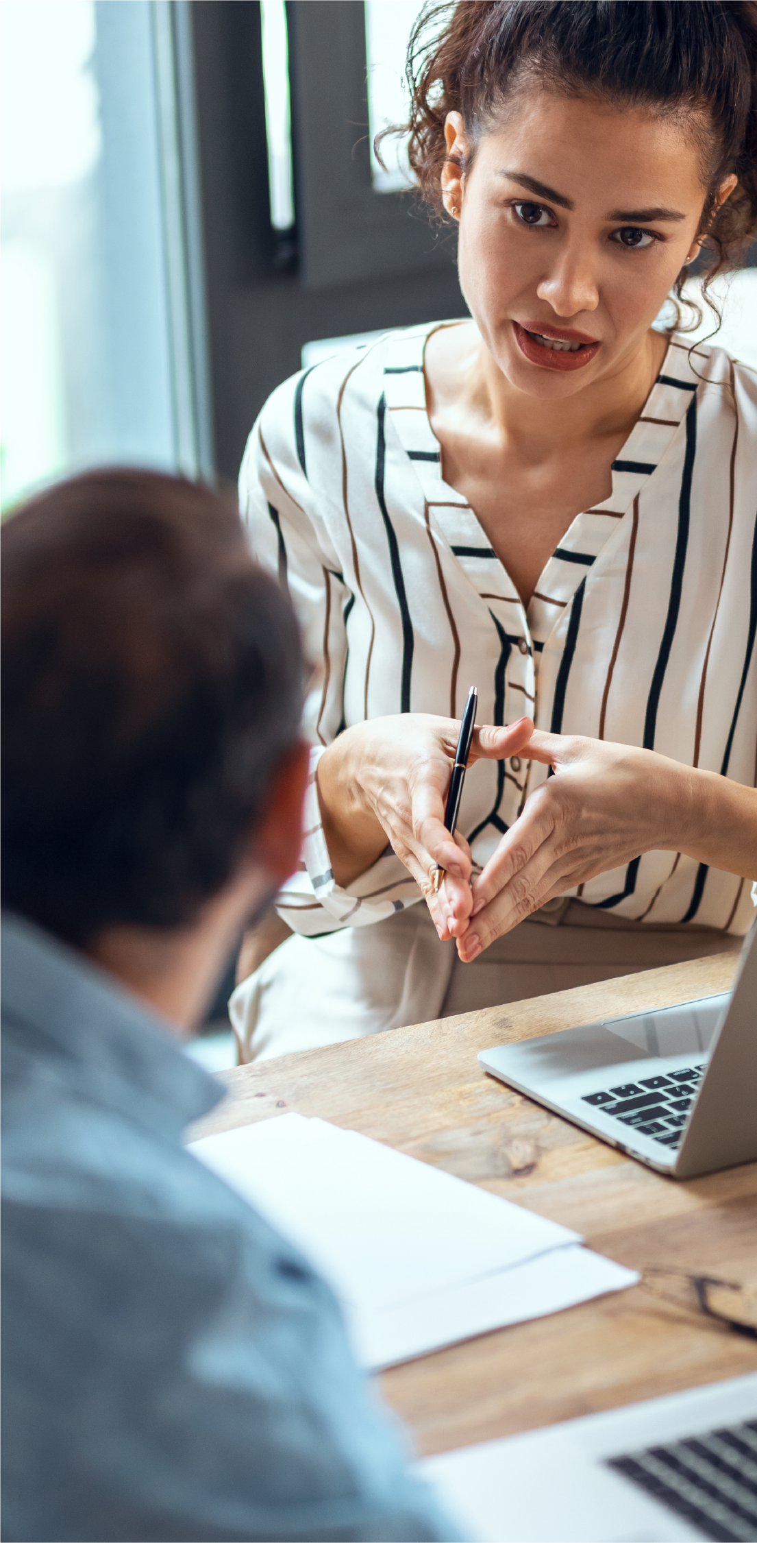 Woman talking to colleague