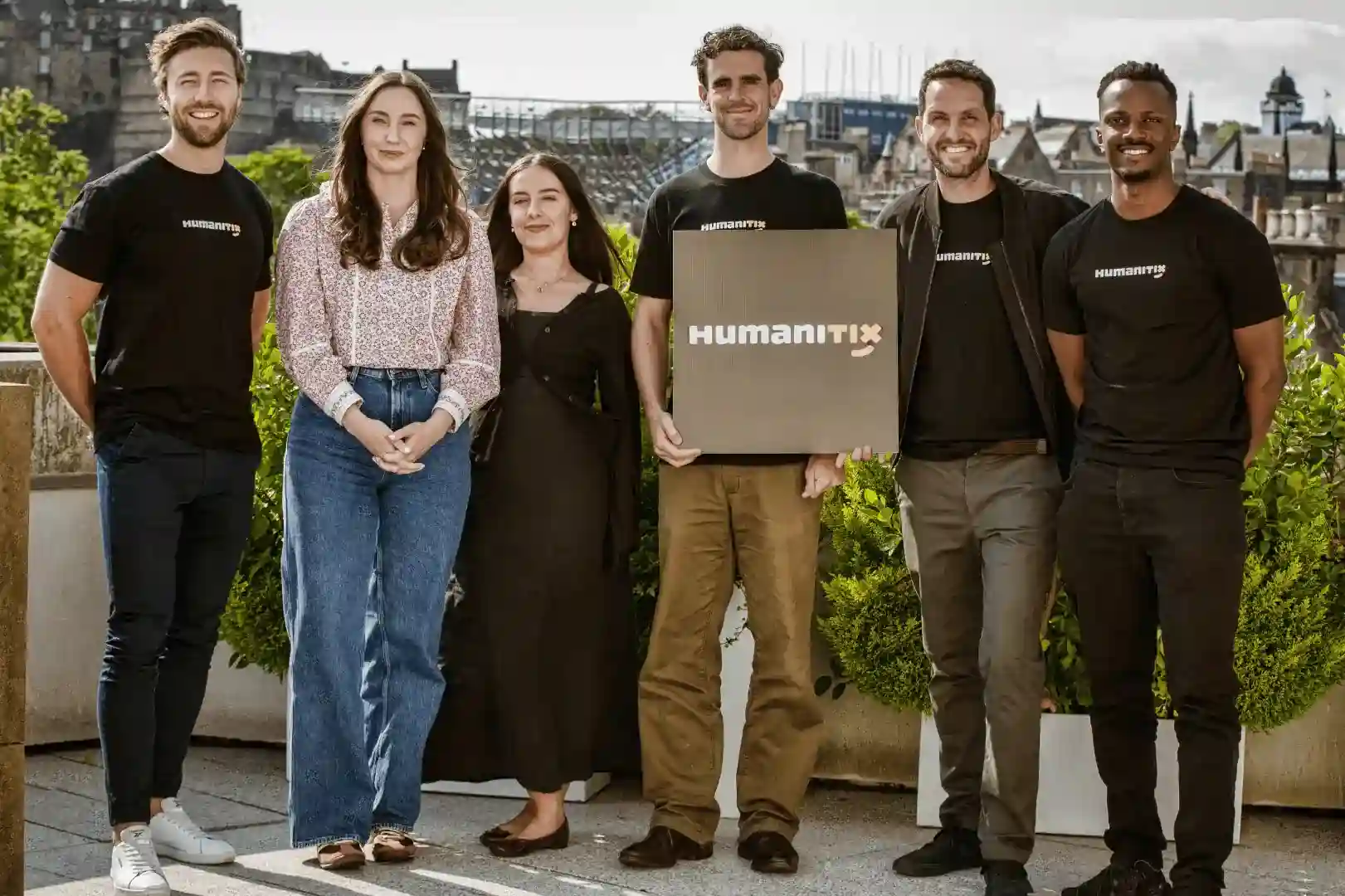 Humanitix UK team with the Edinburgh castle in the background